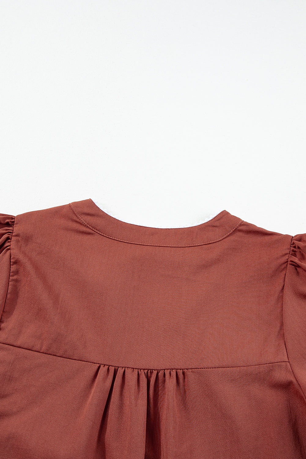 Mineral Red Floral Embroidered Puff Sleeve Split Neck BlouseMaterial:100%Cotton

• Radiate bohemian charm with the Mineral Red blouse featuring intricate floral embroidery and puff sleeves, perfect for a free-spirited look.

