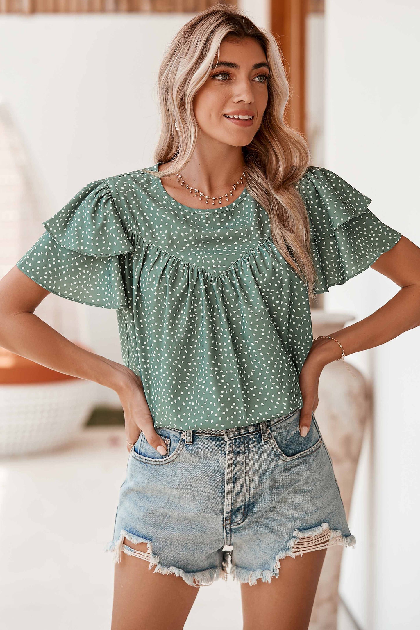 Laurel Green Spotted Print Pleated Ruffle Sleeve BlouseMaterial:100%Polyester



		The spotted print is a timeless and versatile choice that can easily be dressed up or down.
	
	
		The loose fit allows for a relaxed