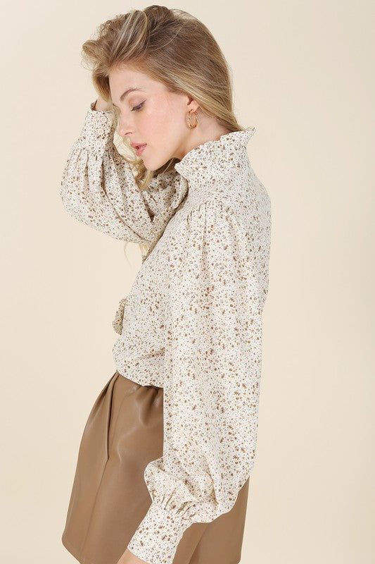 Stand collar floral frill blouse- Stand collar floral frill blouse, shirring at stand collar, shoulder and cuff, ruffle at center front until half up, 7 buttons at center front opening and 3 button