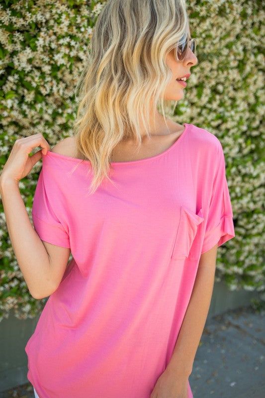 SOLID ONE SHOULDER TOPSOLID JERSEY ONE SHOULDER TOP- Solid one shoulder top- Chest pocket- Loose fit- Solid jersey- Model is 5' 8" 31-24-35 and wearing a Small- 95% RAYON, 5% SPANDEX- MAD