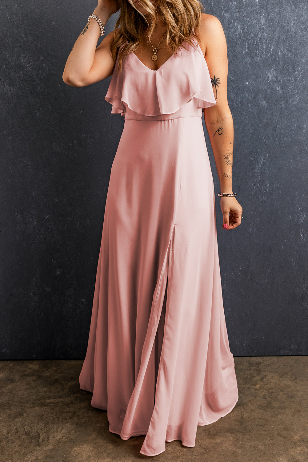 Light Pink Spaghetti Straps V Neck Ruffled Split Long DressMaterial:100%Polyester

• Effortlessly elegant, this dress features a charming ruffled design that cascades down the front.
• The flattering V-neckline and delicat