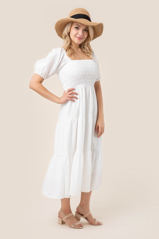 Tiered long dress with puff sleeves- Tiered long dress with puff sleeves- Pattern type : solid- Neck line : square neck- Sleeve type : puff sleeves- Sleeve length : short sleeves- Stretch : stretch- S