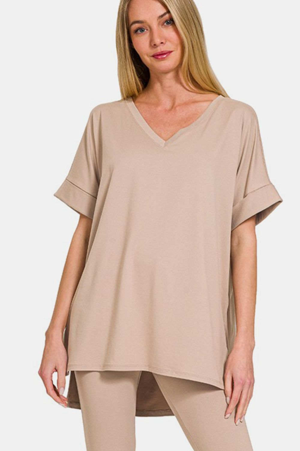 Zenana Full Size V-Neck Rolled Short Sleeve T-Shirt and Leggings LoungThe V-neck rolled short sleeve t-shirt and leggings lounge set offers the perfect blend of comfort and style for a laid-back day. The V-neck design adds a touch of s