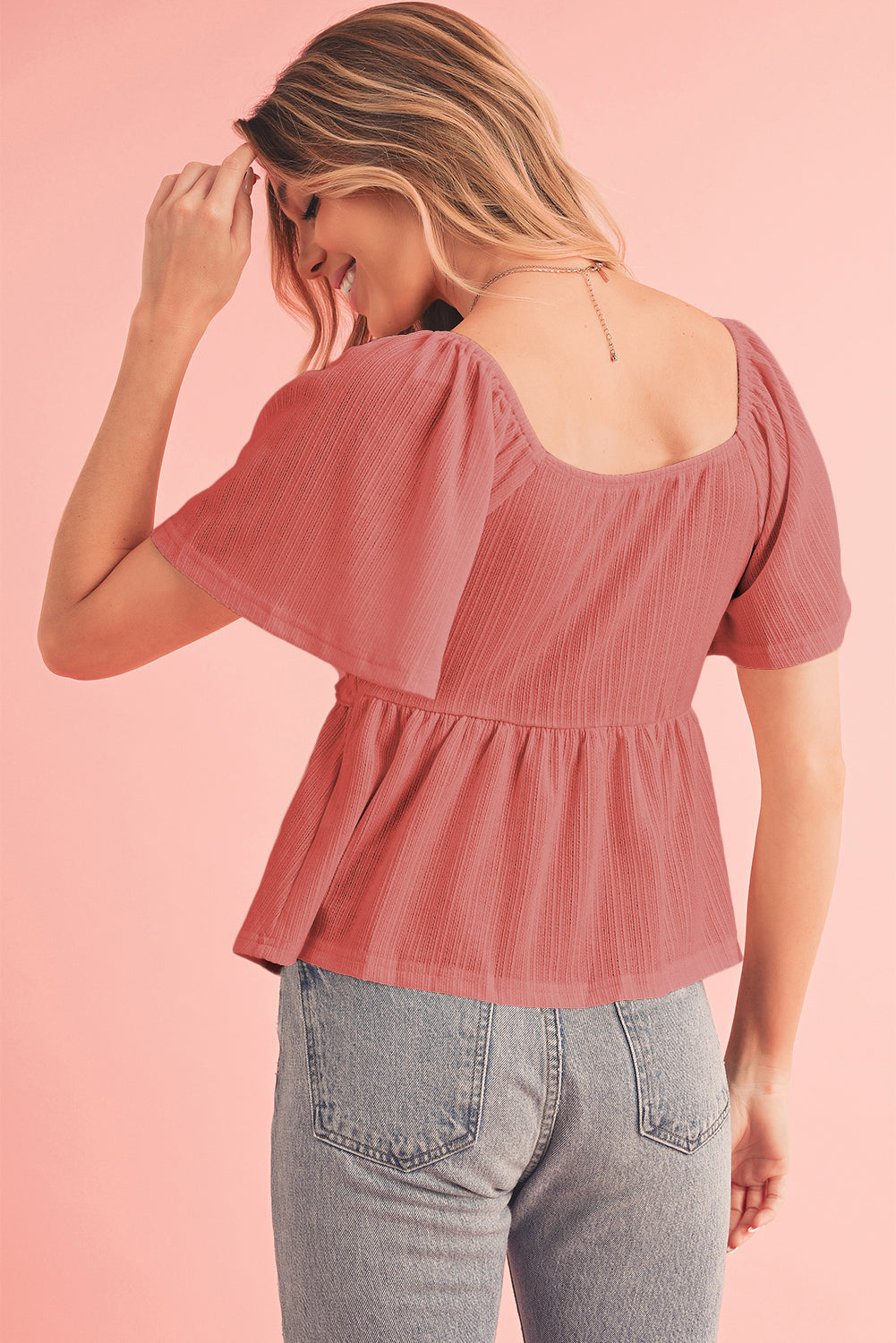 Tomato Red Shirred V Neck Short Flutter Sleeve Textured BlouseMaterial:95%POLYESTER+5%ELASTANE



		The blouse is a charming and feminine top featuring a shirred V-neckline and delicate flutter sleeves, adding a touch of eleg