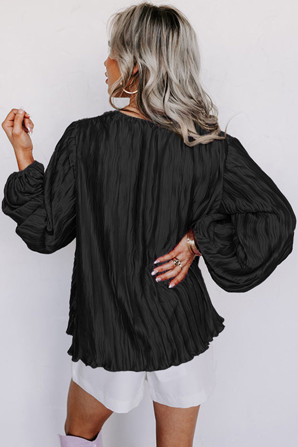 Black Textured Bubble Sleeve V Neck Loose BlouseMaterial:100%Polyester

• Effortlessly chic, this black textured blouse features bubble sleeves that add a touch of playfulness to your outfit, perfect for daily we