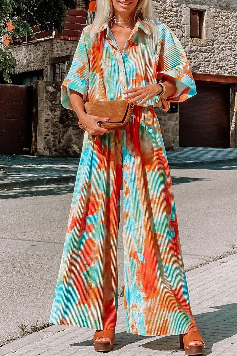 Multicolor Bohemian Tie Dye Pleated Wide Leg JumpsuitMaterial:100%Polyester



		•Made of soft and flowy fabric for comfort and movement.
	
	
		•Features a pleated design for a flattering fit.
	
	
		•Wide leg c