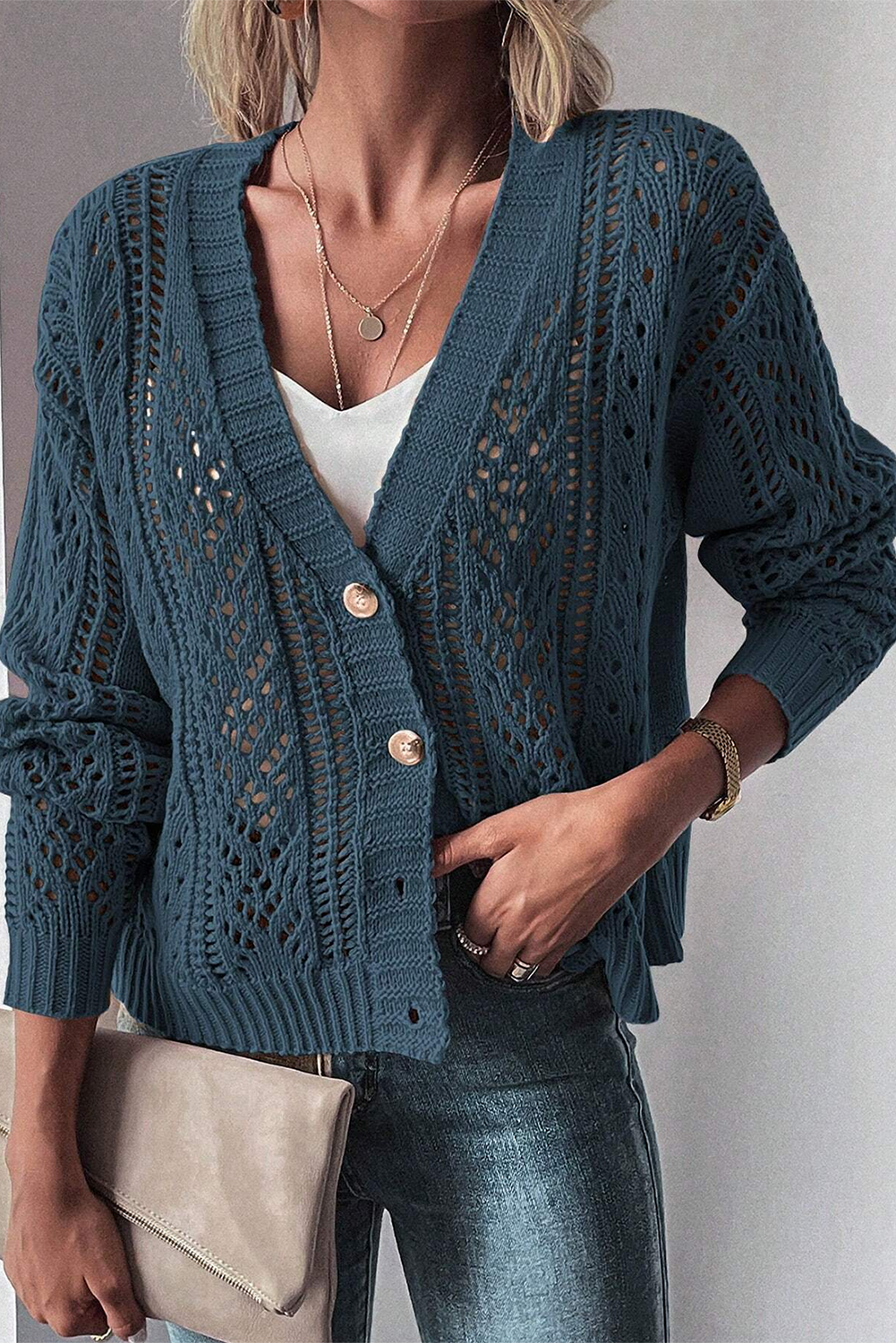 Real Teal Hollow Knit Drop Shoulder CardiganMaterial:60%Cotton+40%Acrylic

• Elevate your casual wardrobe with the cardigan, crafted for comfort and style, ideal for layering during transitional seasons.
• T