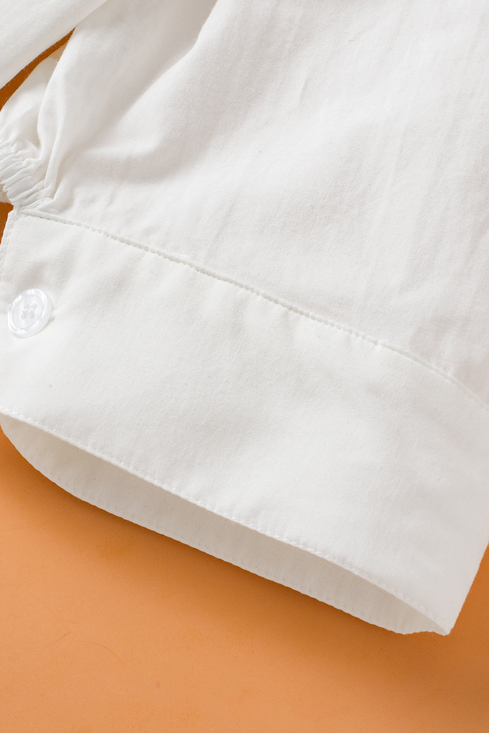 White Solid Color Button Up Puff Sleeve ShirtMaterial:100%Cotton



		Elevate your wardrobe with our shirt, crafted from a crisp and versatile fabric that offers a timeless appeal.
	
	
		This shirt feature