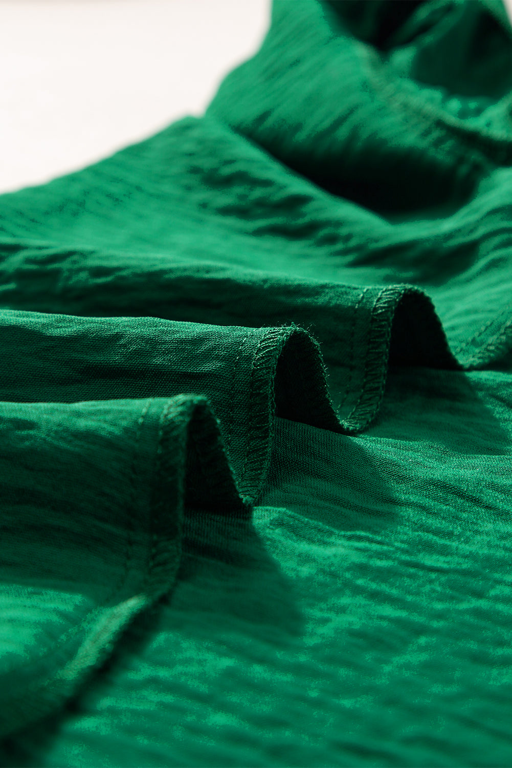 Dark Green Plain Textured Pleated Ruffle Sleeve BlouseMaterial:100%Polyester



		This blouse is crafted with a crinkle texture, providing a unique and fashionable element to elevate your look. 
	
	
		The solid col