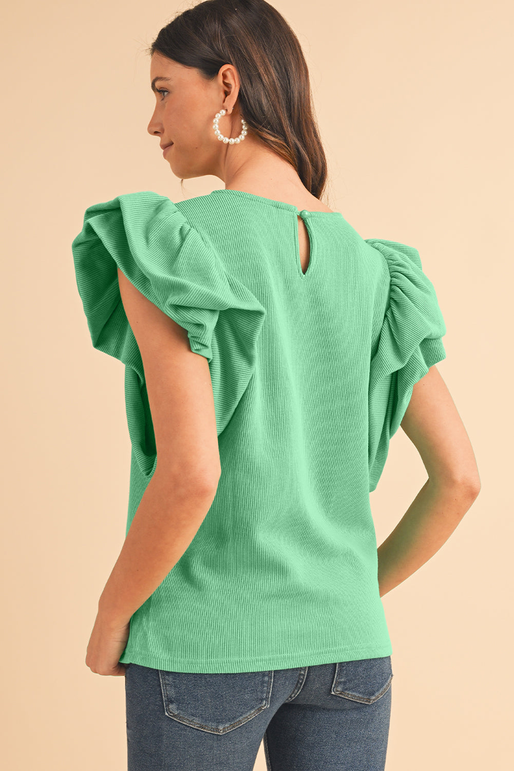 Green Solid Color Ruffle Sleeve Ribbed BlouseMaterial:65%cotton+33%polyester+2%Elastane



		The blouse features ruffle sleeves, which add a playful and romantic touch to the overall design. 
	
	
		The sol