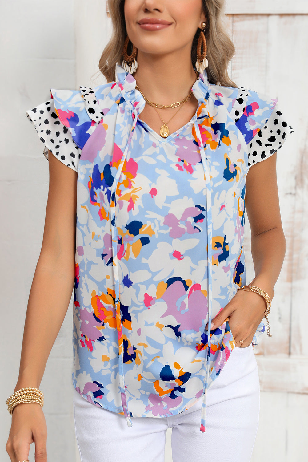 Light Blue Floral Print Ruffle Flutter Sleeve V Neck BlouseMaterial:100%Polyester



		Blouse with vibrant and bold floral print a pretty outlook
	
	
		Feminine ruffled flutter sleeves add a touch of elegance
	
	
		V