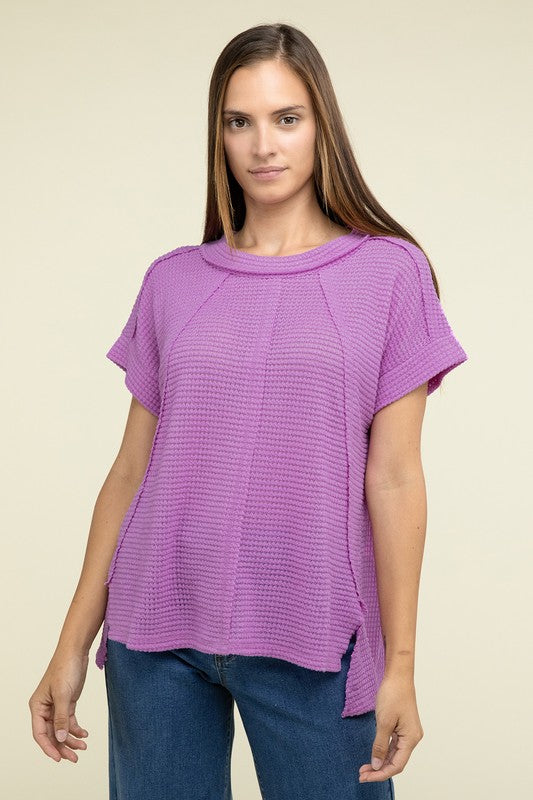 Brushed Waffle Exposed-Seam Short Sleeve TopElevate your casual wardrobe with this Brushed Waffle Top, featuring side slits, exposed seam details, and a stylish hi-low hem. Perfect for a relaxed yet trendy loo