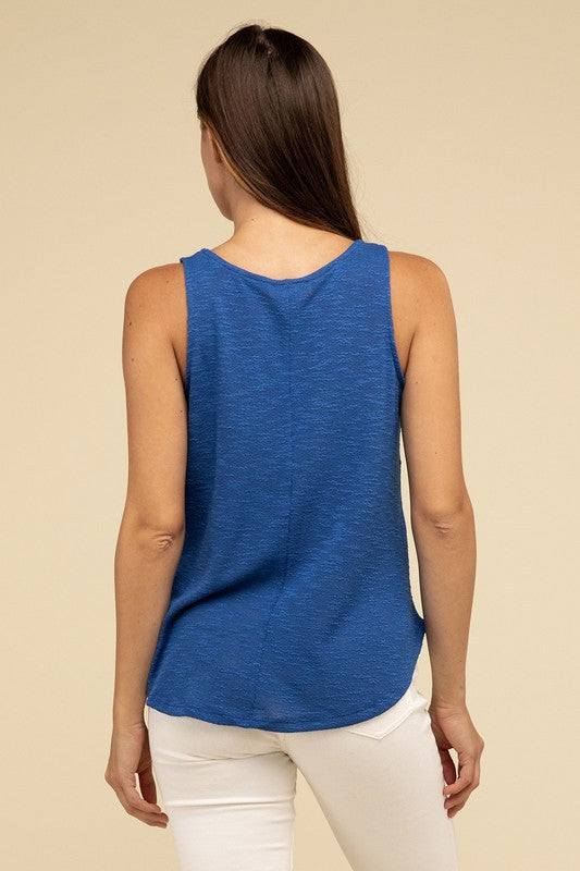 V Neck Sleeveless Cami TopThe V Neck Sleeveless Cami Top is a chic and versatile addition to any wardrobe. Featuring a flattering V neckline and a sleeveless design, this cami top is perfect 