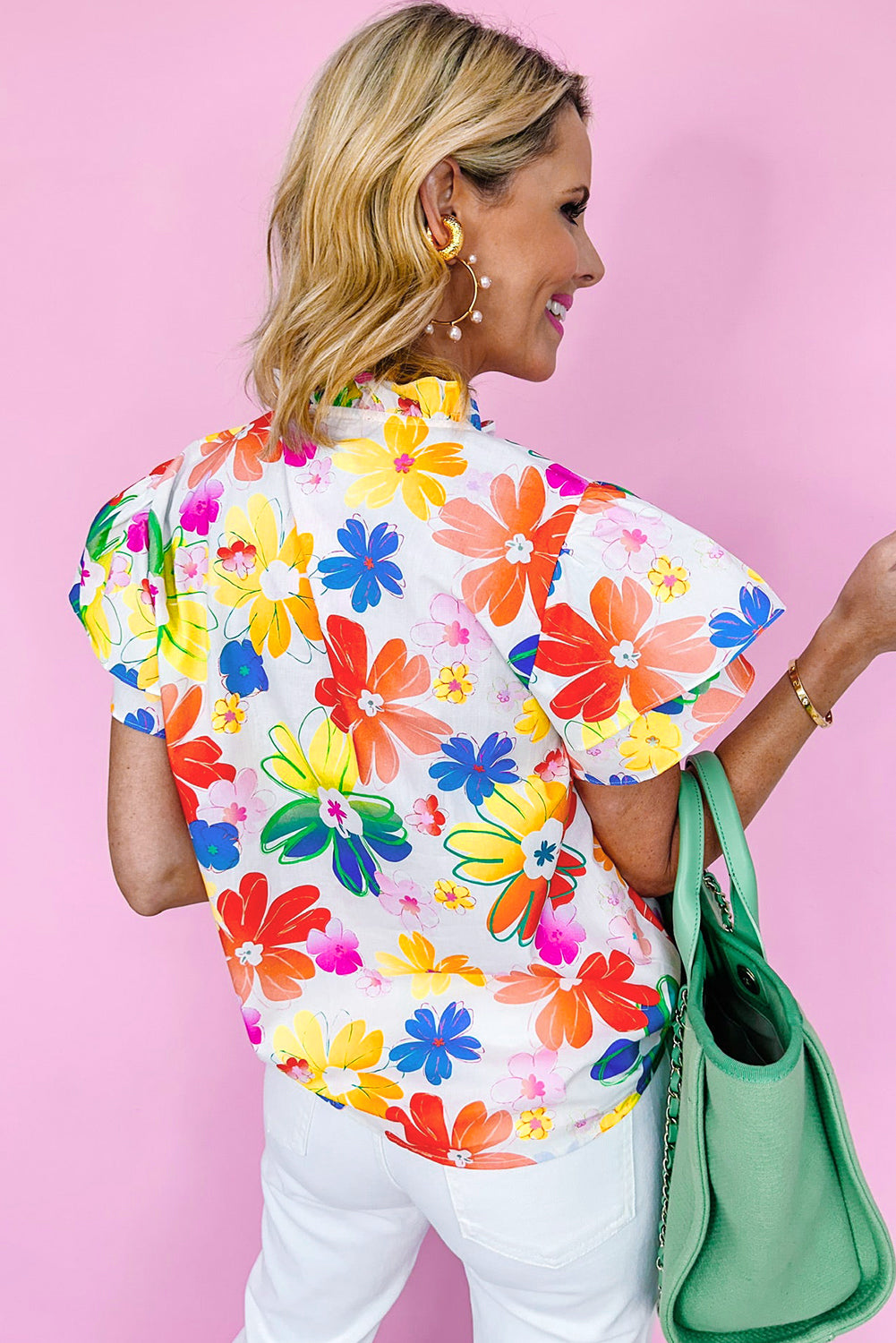 White Flower Flutter Sleeve Frill Neck BlouseMaterial:100%Cotton

• Embrace a touch of elegance with the blouse, featuring intricate floral patterns that exude a boho charm. 
• Delicate ruffles adorn the slee