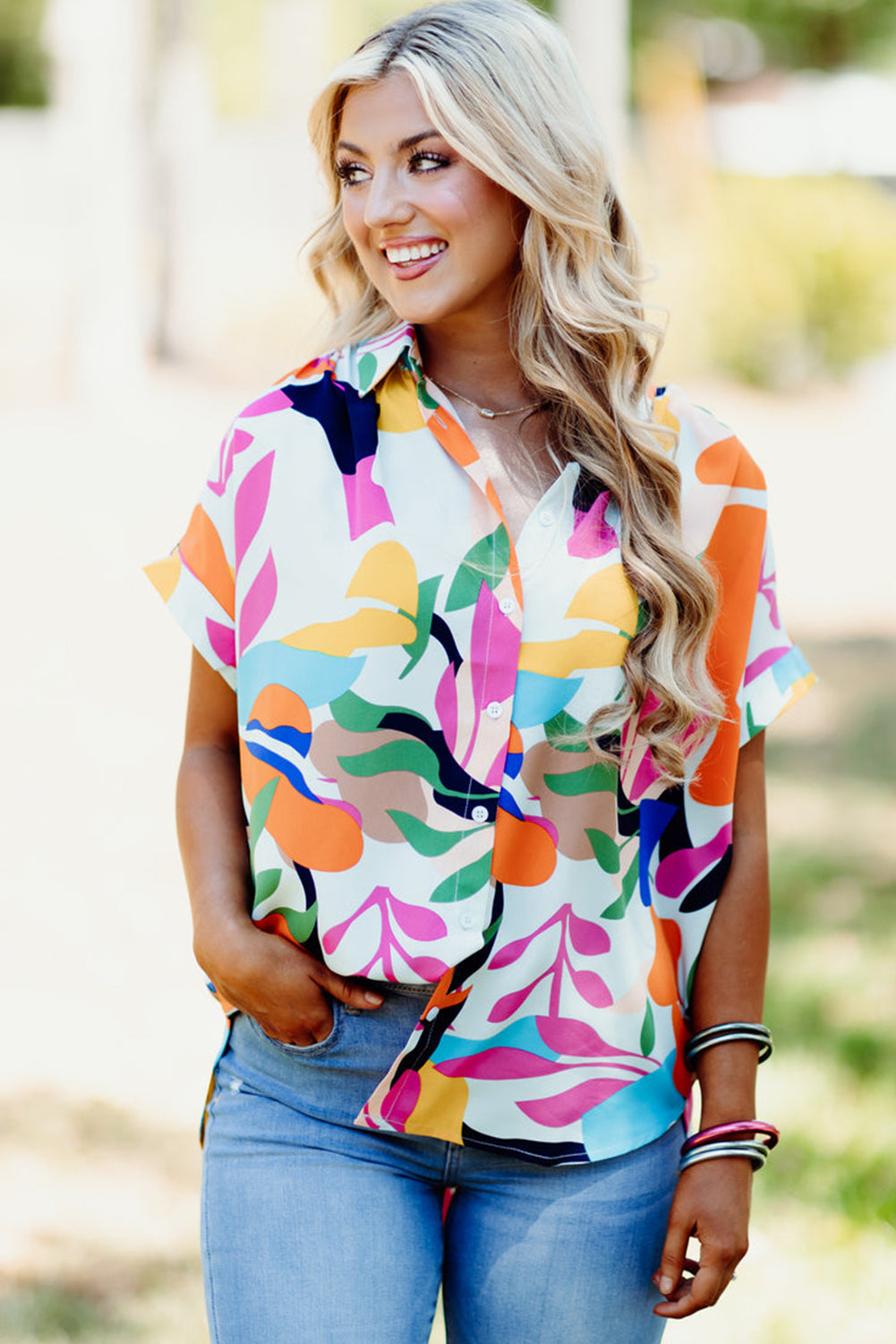 Multicolour Abstract Leaf Print Button Up Short Sleeve BlouseMaterial:100%Polyester

• Infuse your wardrobe with vibrancy in this blouse, perfect for a relaxed yet stylish look.
• The button-up design adds a touch of sophist