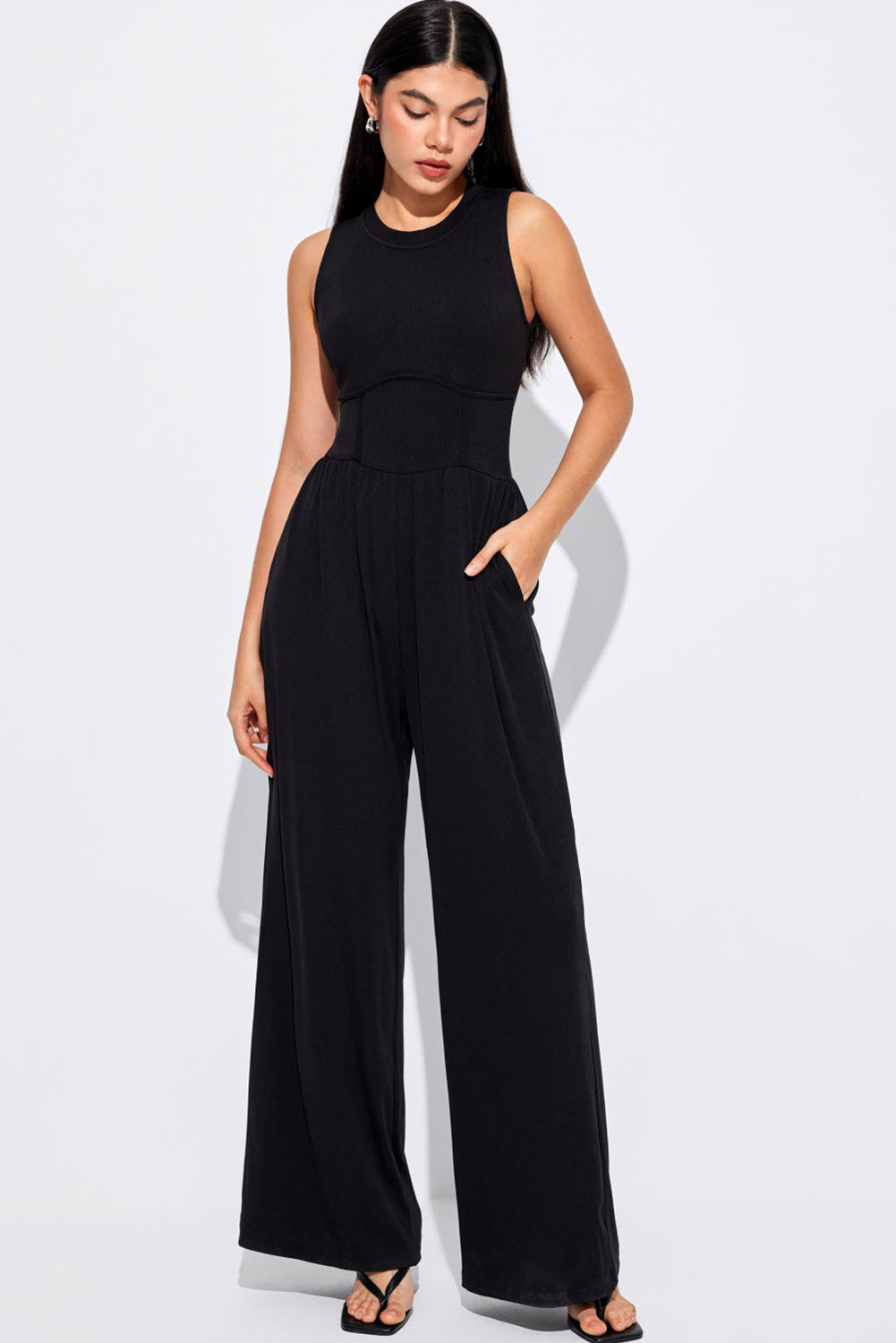 Blackish Green Sleeveless High Waist Wide Leg JumpsuitMaterial:93%Viscose+7%Elastane



		The jumpsuit features a sleeveless design, meaning it does not have sleeves and exposes the arms. 
	
	
		The jumpsuit has a 