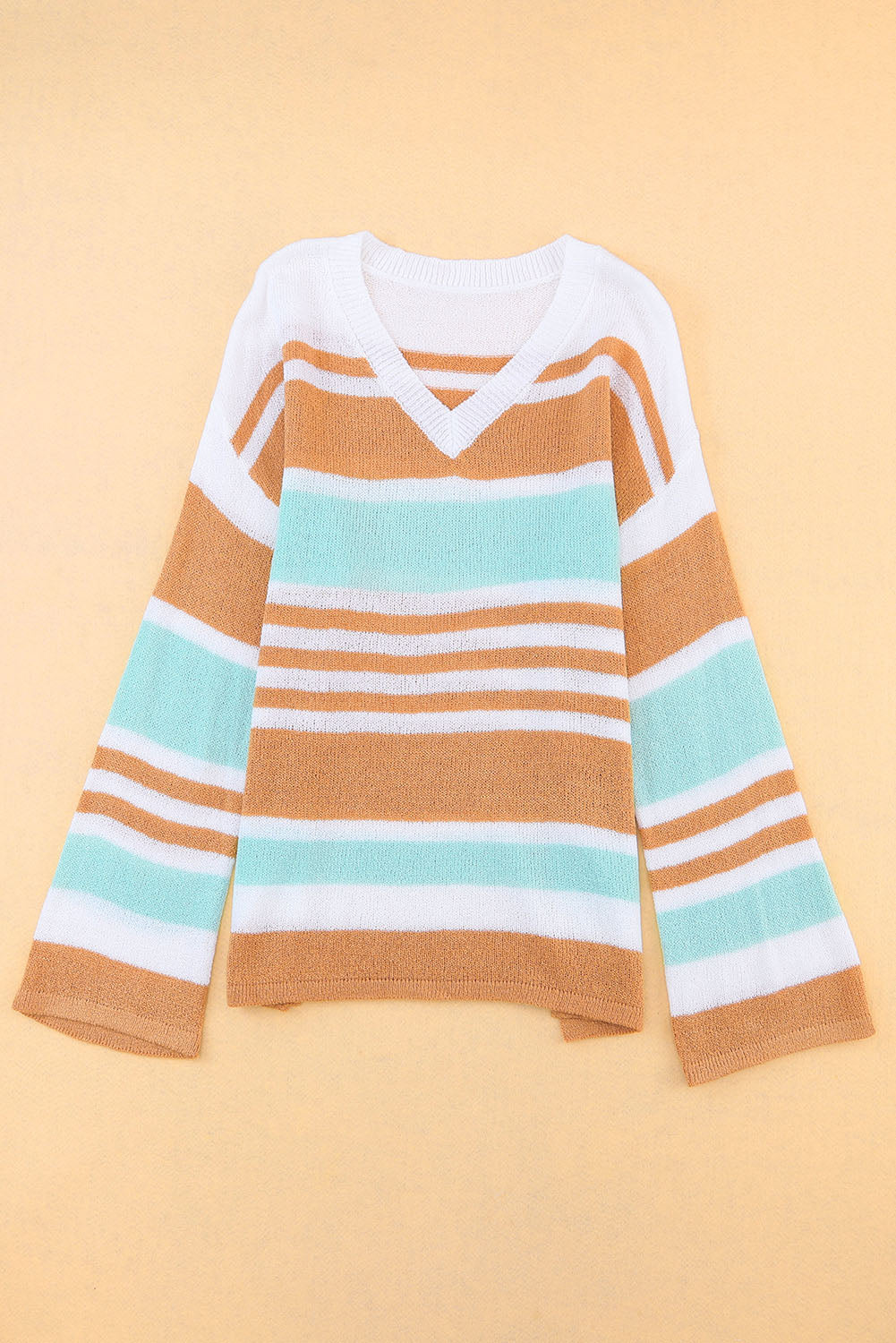 Multicolor Colorblock Stripe V Neck Split SweaterMaterial:100%Acrylic


	


		The V-neckline and split hem add a touch of elegance, while the colorblock design adds a modern and trendy twist.
	
	
		Add a pop