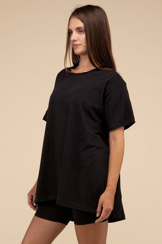 Cotton Drop Shoulder Oversized TopThe Cotton Drop Shoulder Oversized Top is a chic and comfortable addition to your wardrobe. With raw edge details adding a touch of edge, this top offers a relaxed, 