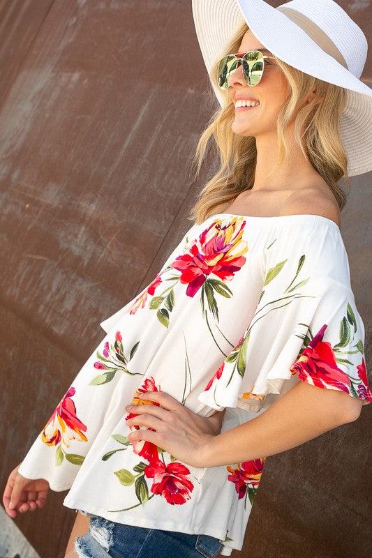 FLORAL OFF SHOULDER TOPFLORAL PRINT JERSEY ELASTICIZED OFF SHOULDER TOP- Floral off shoulder top- Elasticized off shoulder neckline- Ruffle short sleeves- Loose fit- Allover floral print j