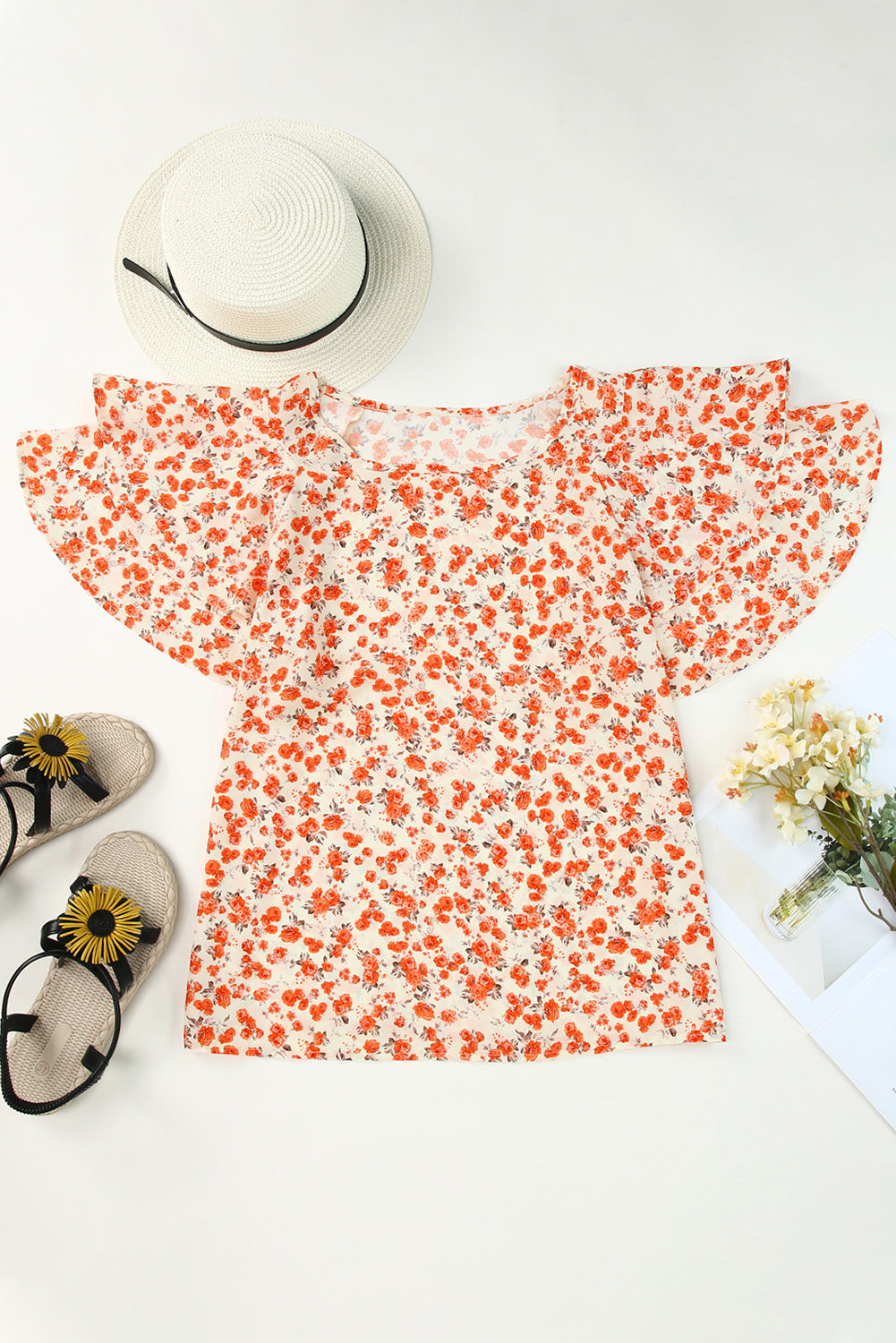 Orange Floral Tiered Flutter Sleeve BlouseMaterial:100%Polyester



		Featuring flowy flutter sleeves that add a touch of femininity to any outfit.
	
	
		Elevate your wardrobe with this stunning tiered 