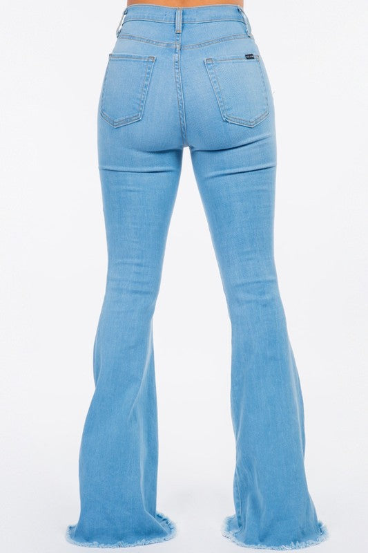 Bell Bottom Jean in Light BlueHigh Rise Bell Bottom Jean features front and back functional pockets, front button and zipper closure, 34" Inseam Length, Frayed Hem, Light Blue Denim, Made in USA
