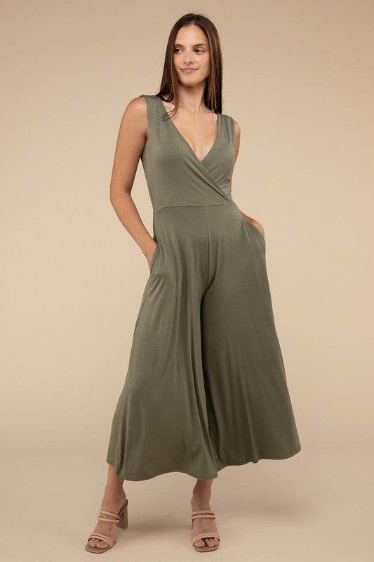 Surplice Neckline Sleeveless JumpsuitThe Surplice Neckline Sleeveless Jumpsuit exudes effortless elegance and modern sophistication. Featuring a surplice neckline, this jumpsuit offers a chic and flatte