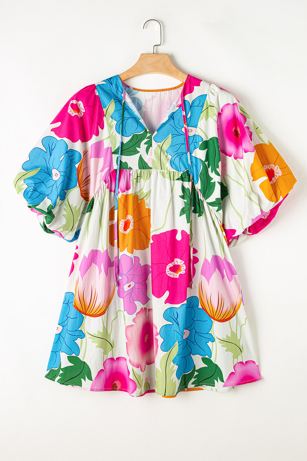 White Puff Sleeve Tied Split Neck Colorful Floral Flowy DressMaterial:100%Cotton


	


		Step into elegance with our mini dress, a vibrant and feminine piece designed to make a statement.
	
	
		This dress features charm