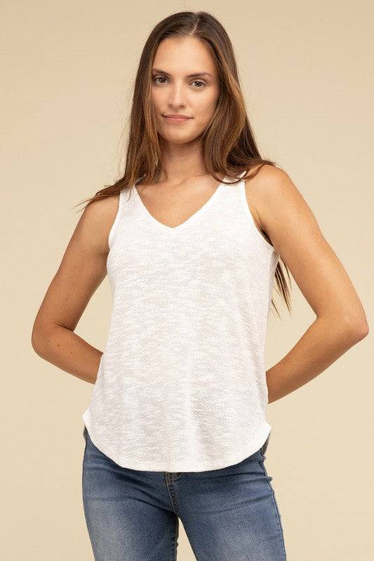 V Neck Sleeveless Cami TopThe V Neck Sleeveless Cami Top is a chic and versatile addition to any wardrobe. Featuring a flattering V neckline and a sleeveless design, this cami top is perfect 