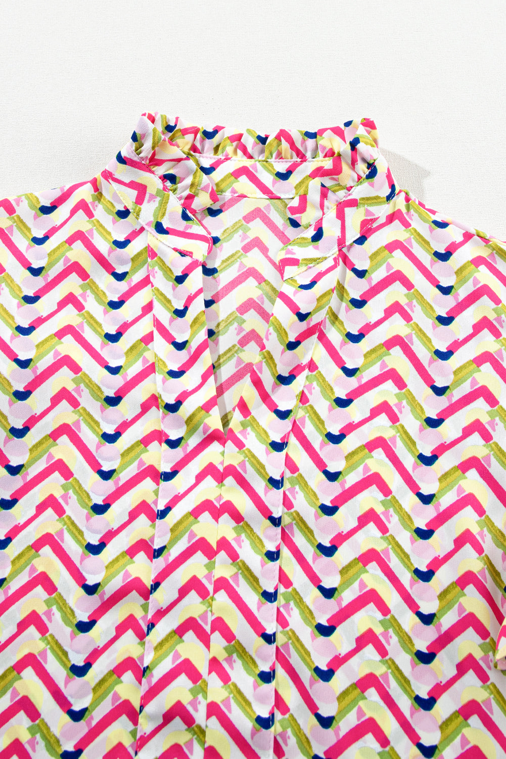 Multicolor Chevron Print Frill V Neck Ruffle BlouseMaterial:100%Polyester



		Be a style icon in this printed blouse
	
	
		This stylish top is featured with chevron print all over
	
	
		It has a ruffled notc