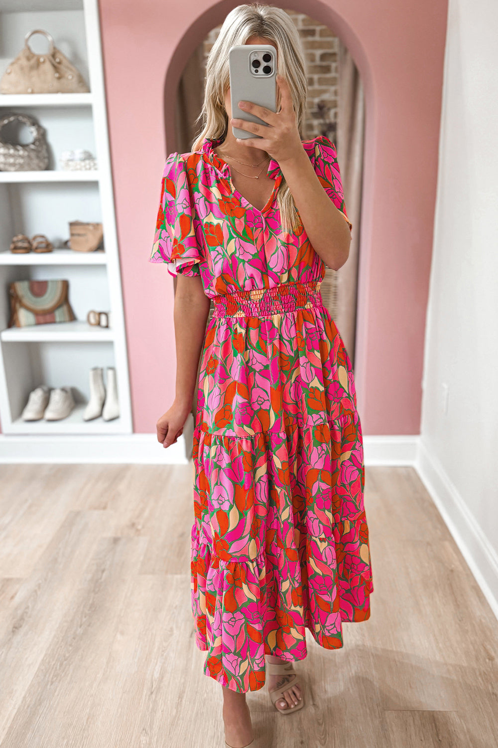 Rose Floral Flounce Sleeve Smocked Waist Tiered Maxi DressMaterial:100%Polyester

• Exude bohemian elegance in this maxi dress, featuring a smocked waist for a flattering silhouette.
• The tiered design adds a whimsical t