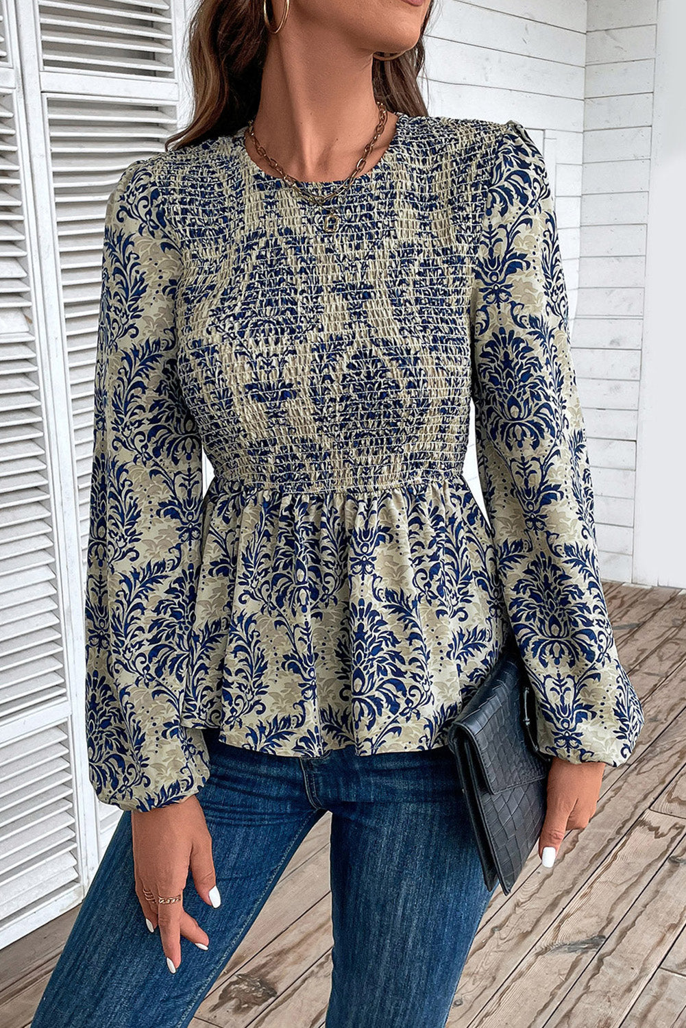 Sky Blue Ethnic Print Balloon Sleeve Smocked Peplum BlouseMaterial:100%Polyester

• Elevate your bohemian style with our blouse, featuring intricate ruffle details for a touch of whimsy.
• The shirred design creates a fla