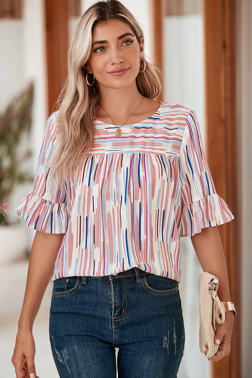 White Abstract Print Ruffle Half Sleeve BlouseMaterial:100%Polyester



		The blouse features a colorblock design, where different colors are strategically placed to create a visually striking contrast. 
	
	