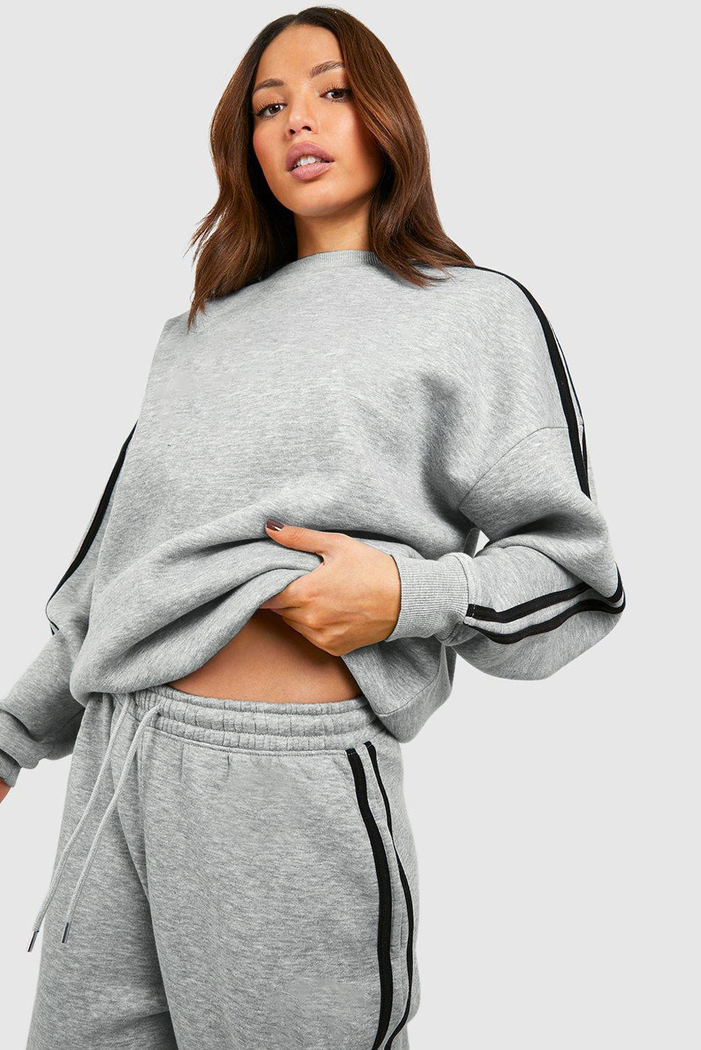 Light Grey Solid Color Side Striped Sweatshirt Pants SetMaterial:50%Polyester+50%Cotton

• This pants set exudes a modern appeal perfect for casual outings or lounging at home.
• Crafted from high-quality fabric for a s