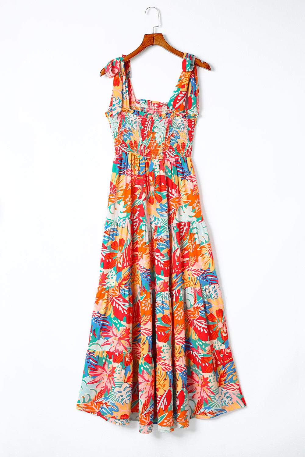 Multicolor Boho Tropical Print Smocked Ruffle Tiered Maxi DressMaterial:100%Polyester



		•The tiered design of the dress adds volume, creating a flowy and feminine look.
	
	
		•Smocked bodice and tie shoulder straps give 