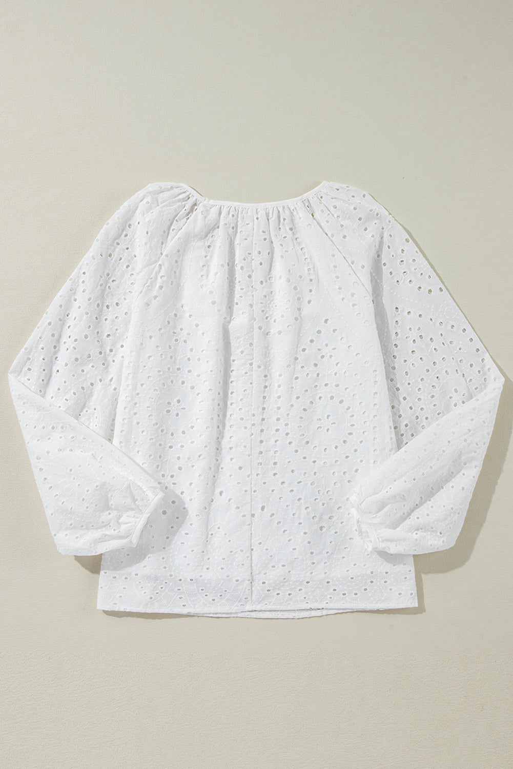 White Eyelet Embroidered V Neck Puff Sleeve BlouseMaterial:100%Cotton

• Delicate white eyelet embroidery adorns this charming blouse, adding a touch of elegance to your outfit. 
• The V-neck design creates a flat