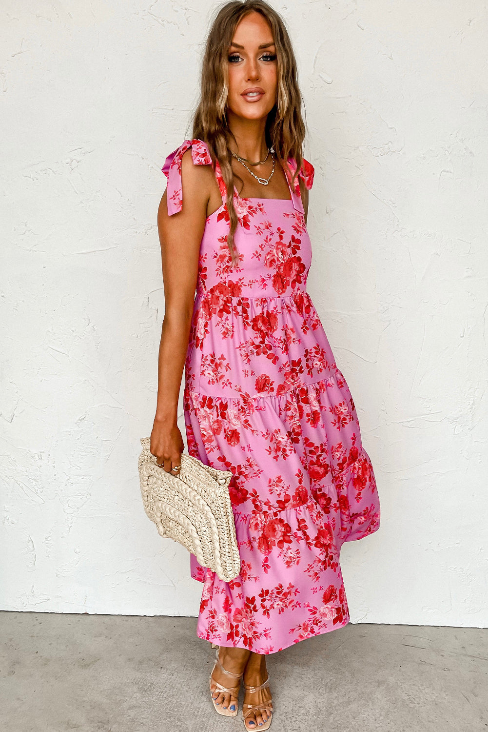 Pink Tie Shoulder Straps Tiered Floral DressMaterial:100%Polyester



		This floral dress is flattering fit to show personal charm
	
	
		The tie shoulder straps are flexible and adjustable
	
	
		The fi