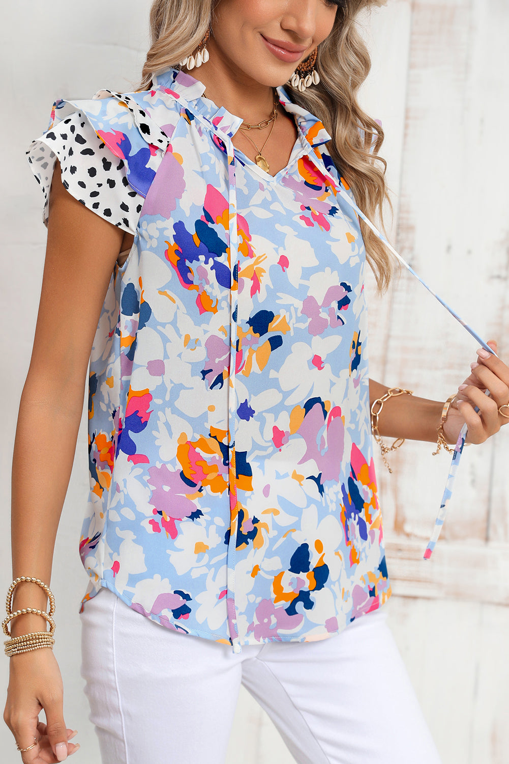 Light Blue Floral Print Ruffle Flutter Sleeve V Neck BlouseMaterial:100%Polyester



		Blouse with vibrant and bold floral print a pretty outlook
	
	
		Feminine ruffled flutter sleeves add a touch of elegance
	
	
		V