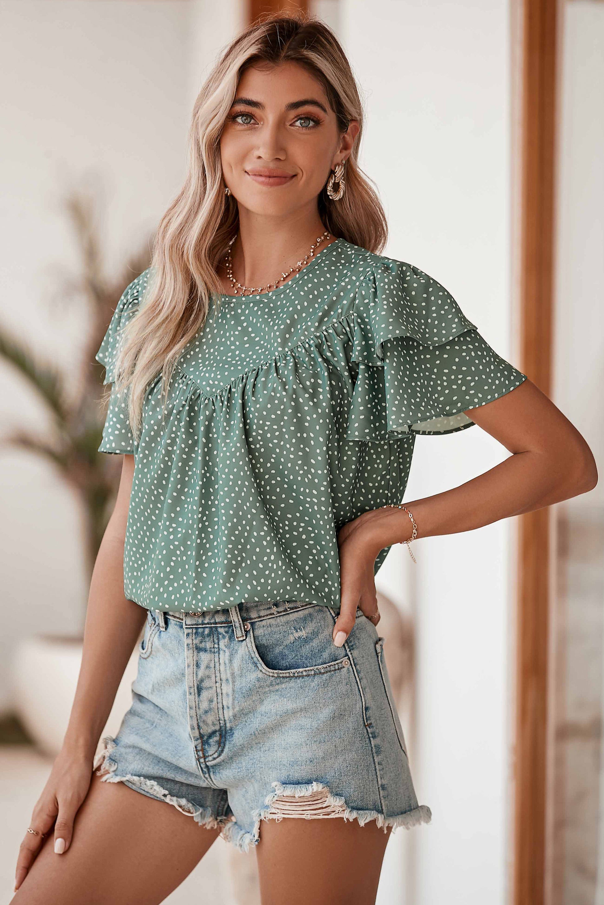 Laurel Green Spotted Print Pleated Ruffle Sleeve BlouseMaterial:100%Polyester



		The spotted print is a timeless and versatile choice that can easily be dressed up or down.
	
	
		The loose fit allows for a relaxed