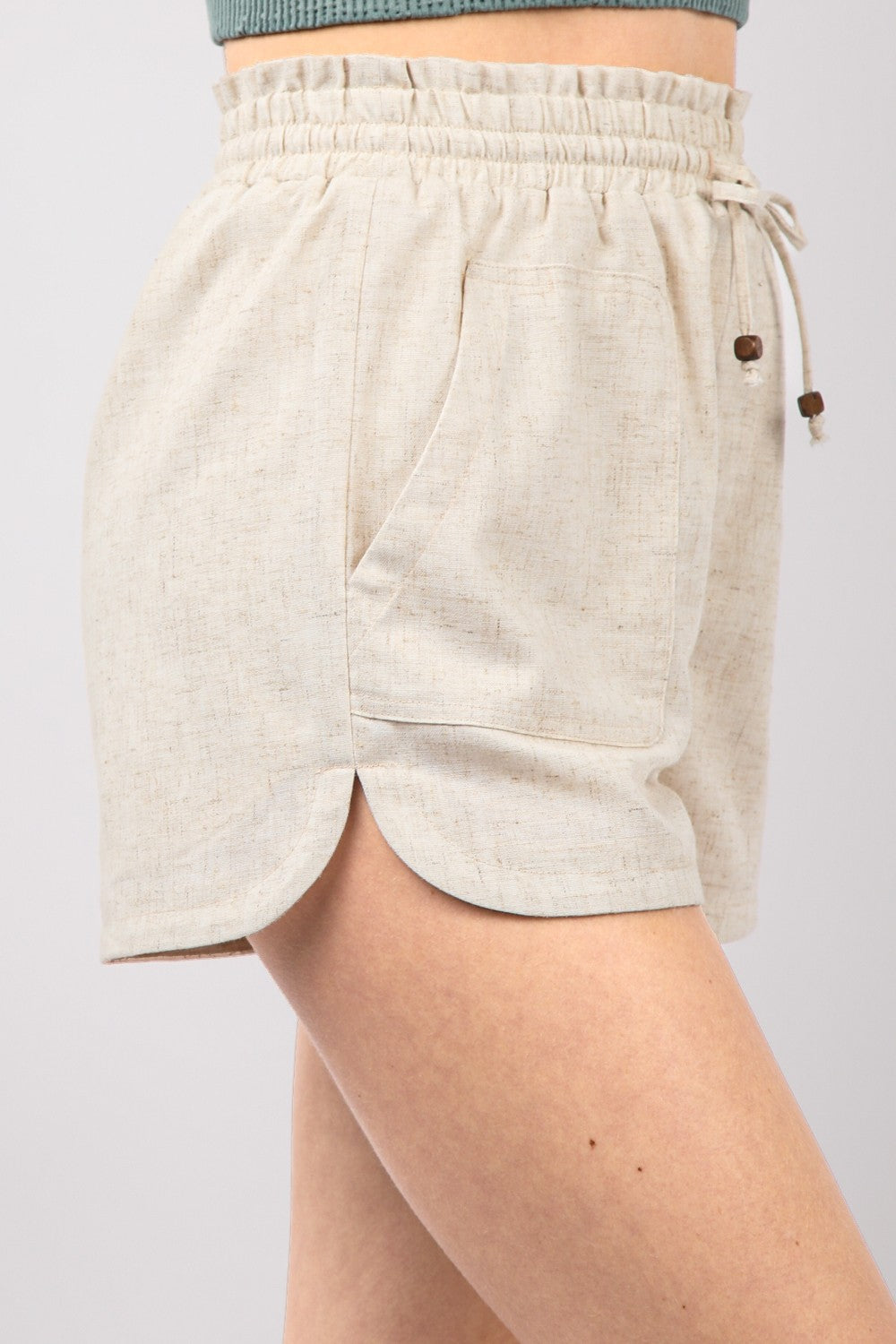 VERY J Drawstring Elastic Waist Linen ShortsStay cool and comfortable in these Elastic Waist Solid Linen Shorts featuring side pockets and a round hem for added style. These Cool Comfort Eco-Friendly Recycling