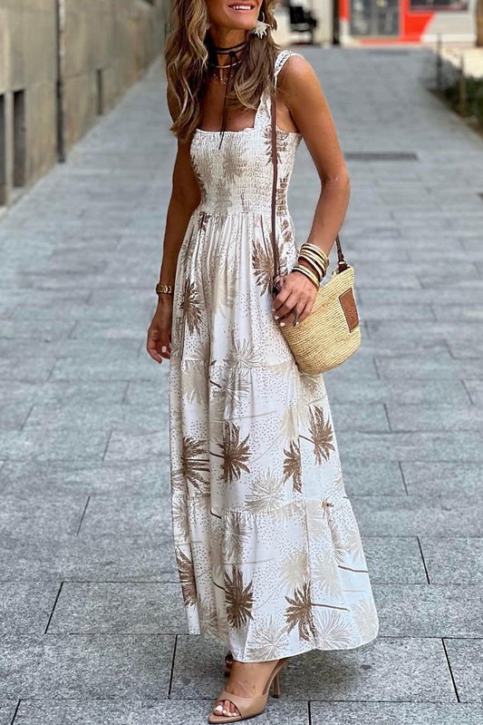 White Tropical Print Smocked Ruffled Straps Maxi DressMaterial:100%Viscose



		The maxi dress is a vibrant and summery dress featuring a tropical print, perfect for adding a pop of color to your wardrobe.
	
	
		Ma