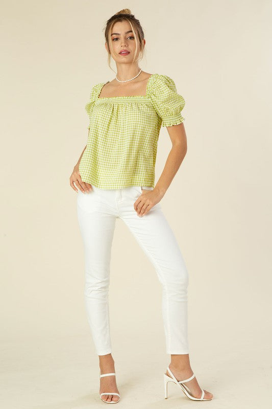 Smocked blouse with puff sleeve- Smocked blouse with puff sleeve- Pattern type : gingham check (yarn dyed)- Neck line : square neck- Sleeve type : puff sleeves- Sleeve length : short sleeves- Stre