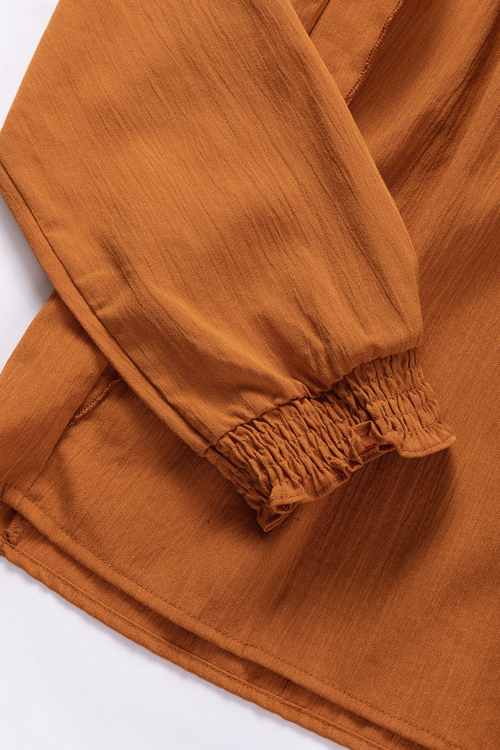 Camel Ruffle Solid Color Pleated Smocked Long Sleeve BlouseMaterial:50%Viscose+28%Polyester+22%Polyamide



		The blouse is made of high-quality fabric that is comfortable to wear and easy to maintain.
	
	
		The ruffled