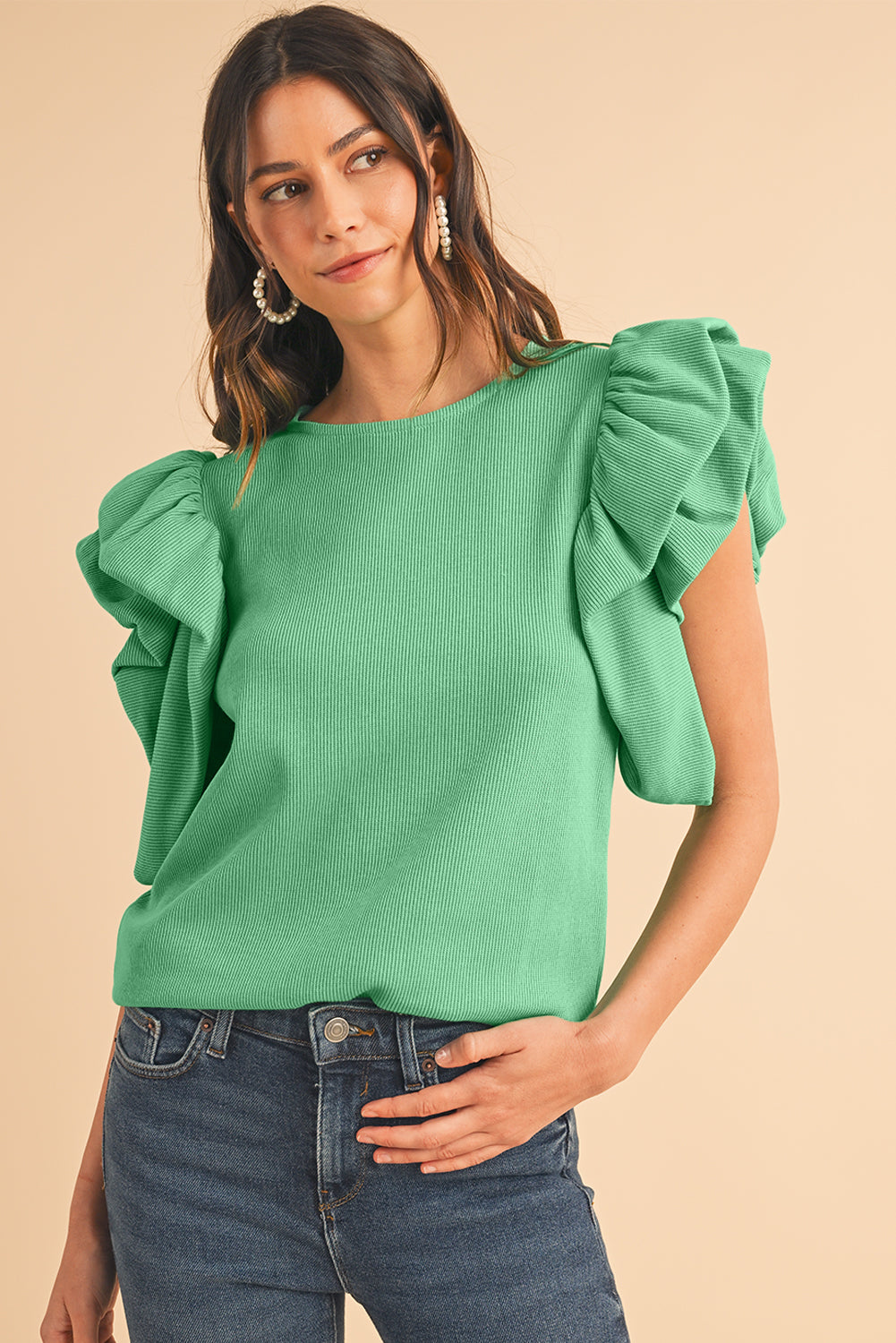 Green Solid Color Ruffle Sleeve Ribbed BlouseMaterial:65%cotton+33%polyester+2%Elastane



		The blouse features ruffle sleeves, which add a playful and romantic touch to the overall design. 
	
	
		The sol