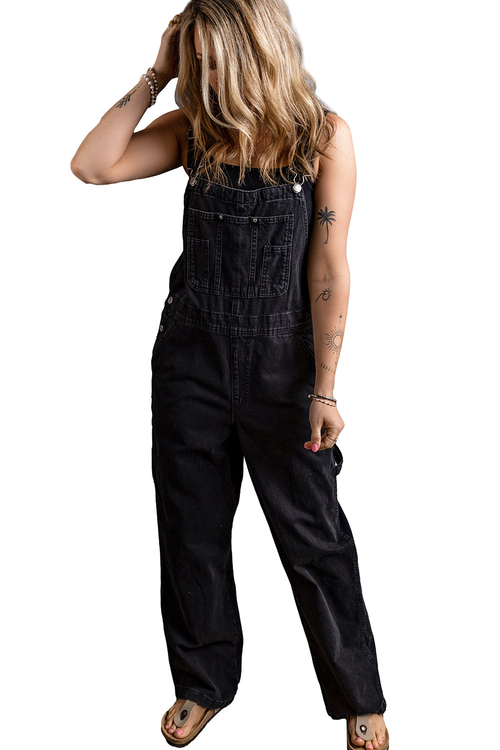 Black Adjustable Buckle Straps Multi Pocket Denim JumpsuitMaterial:65%Cotton+33%Polyester+2%Elastane

• Stylishly versatile, this black denim jumpsuit features adjustable buckle straps for a customized fit that effortlessl