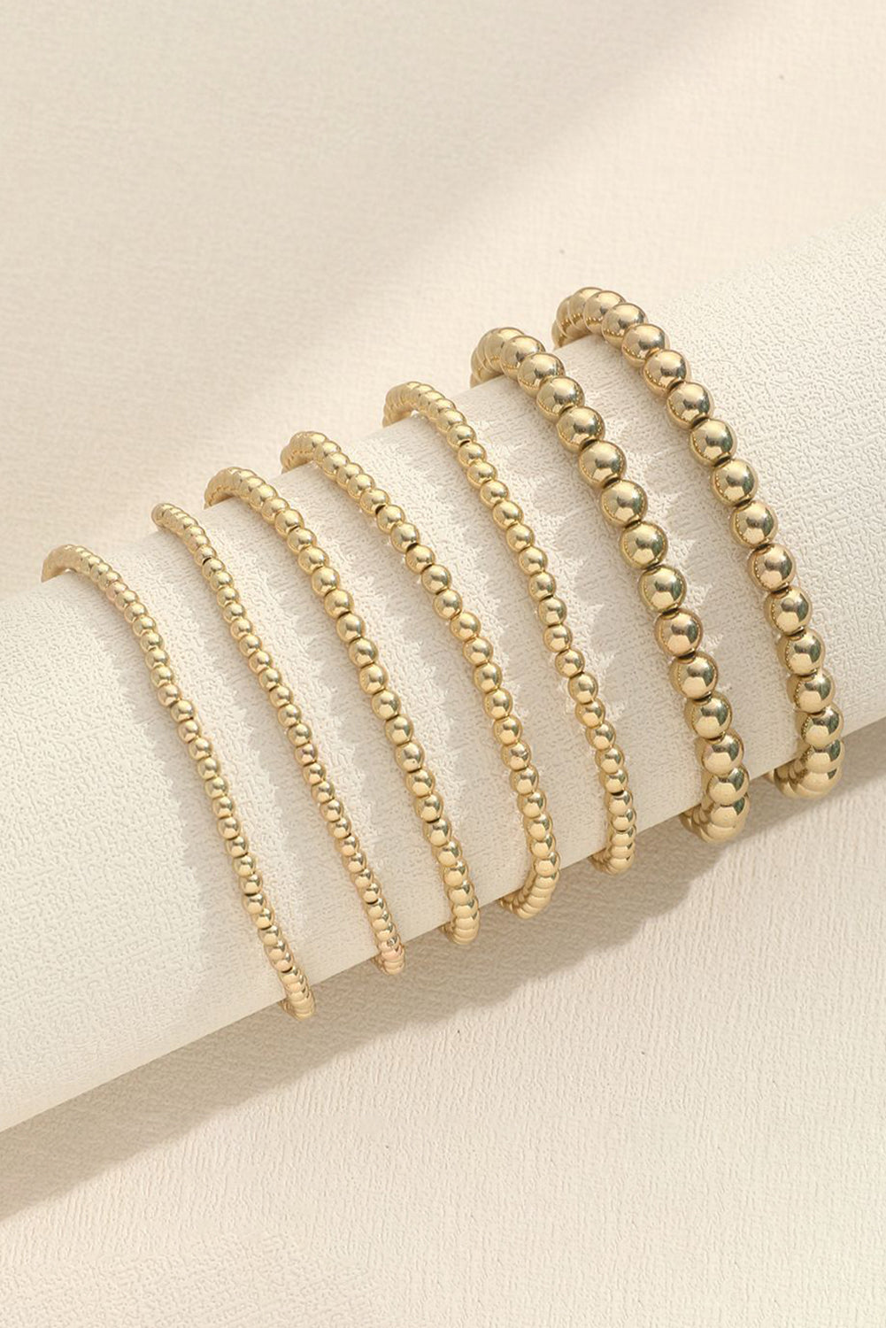 Gold 7pcs Set Minimalist Beaded Luxury Bracelet SetMaterial:100%Alloy

• Elevate your wrist game with this bracelet set, perfect for adding a touch of elegance to any outfit.
• This set includes seven unique bracel