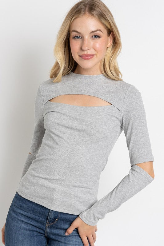 RIBBED FITTED LONG SLEEVE TOP WITH CHEST CUTOUT AN-Round neck cutout chest and slit sleeves fitted top-Ribbed material- Model in taupe is 5' 8" 32-23-34 and wearing a small
Style: casual
Print / Pattern: solid rib
S