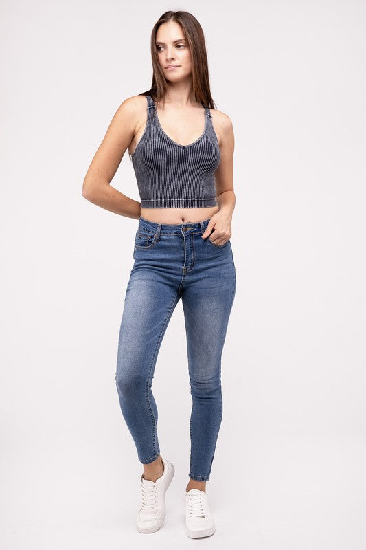 Washed Ribbed Cropped V-Neck Tank TopThe Washed Ribbed Cropped V-Neck Tank Top offers a stylish and comfortable option for your wardrobe. Made from ribbed fabric with a washed finish, it exudes a casual