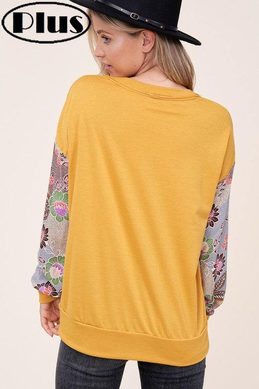 PLUS WOVEN FLORAL MIXED TOPFRENCH TERRY SOLID AND WOVEN FLORAL PRINT MIXED LONG SLEEVE SIDE POCKET RAW EDGE DETAIL PLUS TOP 
Style: Casual
Print / Pattern: SOLID AND WOVEN FLORAL 
Fit: Regular