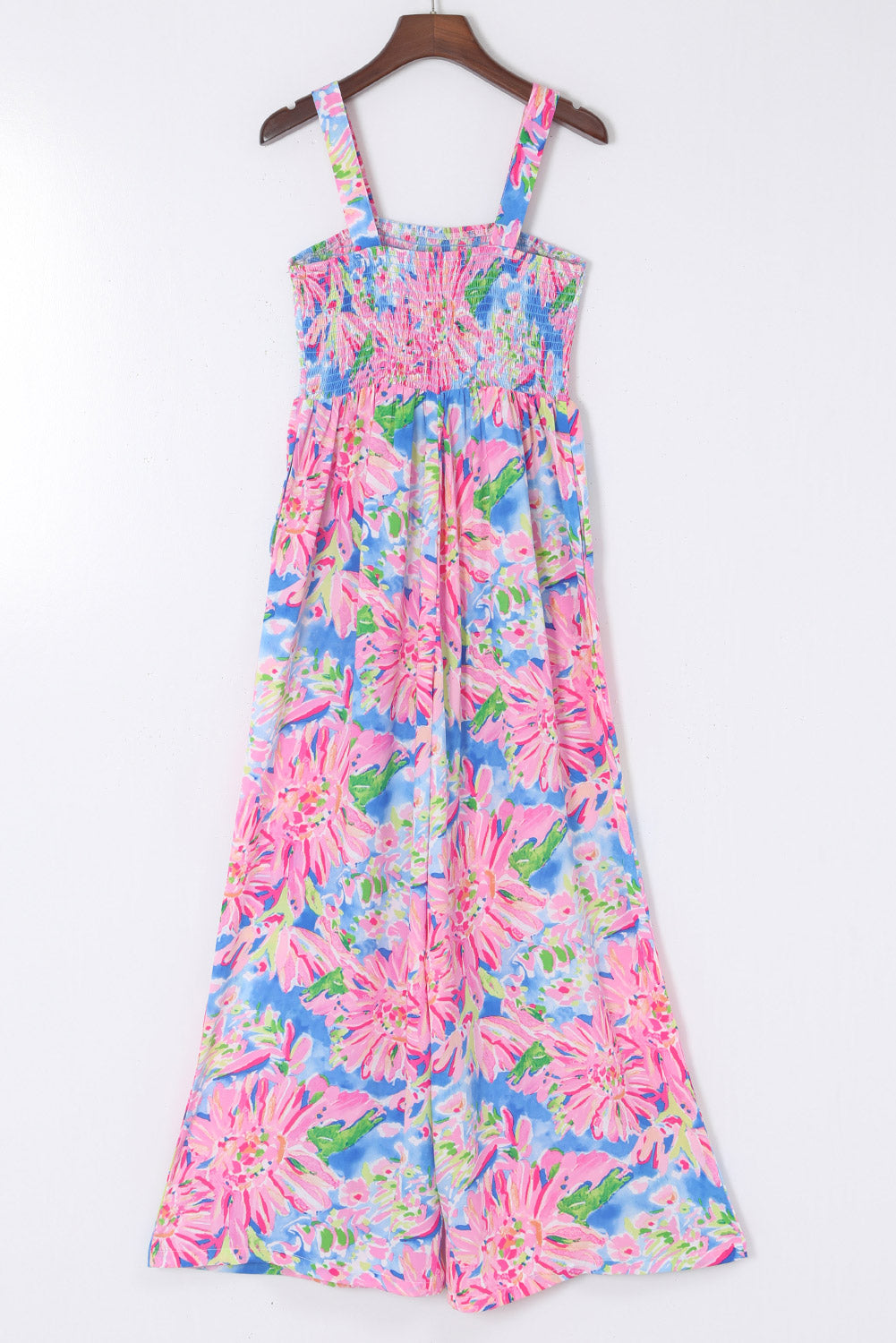 Pink Abstract Floral Painting Smocked Wide Leg JumpsuitMaterial:100%Polyester



		The jumpsuit features a colorful abstract floral print that adds a playful touch to the piece. 
	
	
		The smocked bodice creates a f