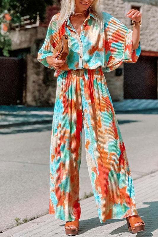 Multicolor Bohemian Tie Dye Pleated Wide Leg JumpsuitMaterial:100%Polyester



		•Made of soft and flowy fabric for comfort and movement.
	
	
		•Features a pleated design for a flattering fit.
	
	
		•Wide leg c